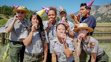 NPS Employees in birthday hats