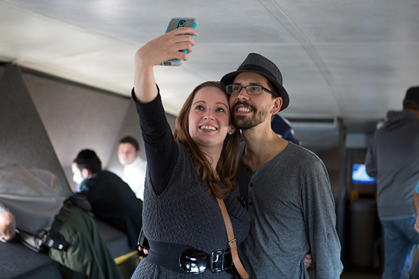Couple taking a selfie at the top of the Arch