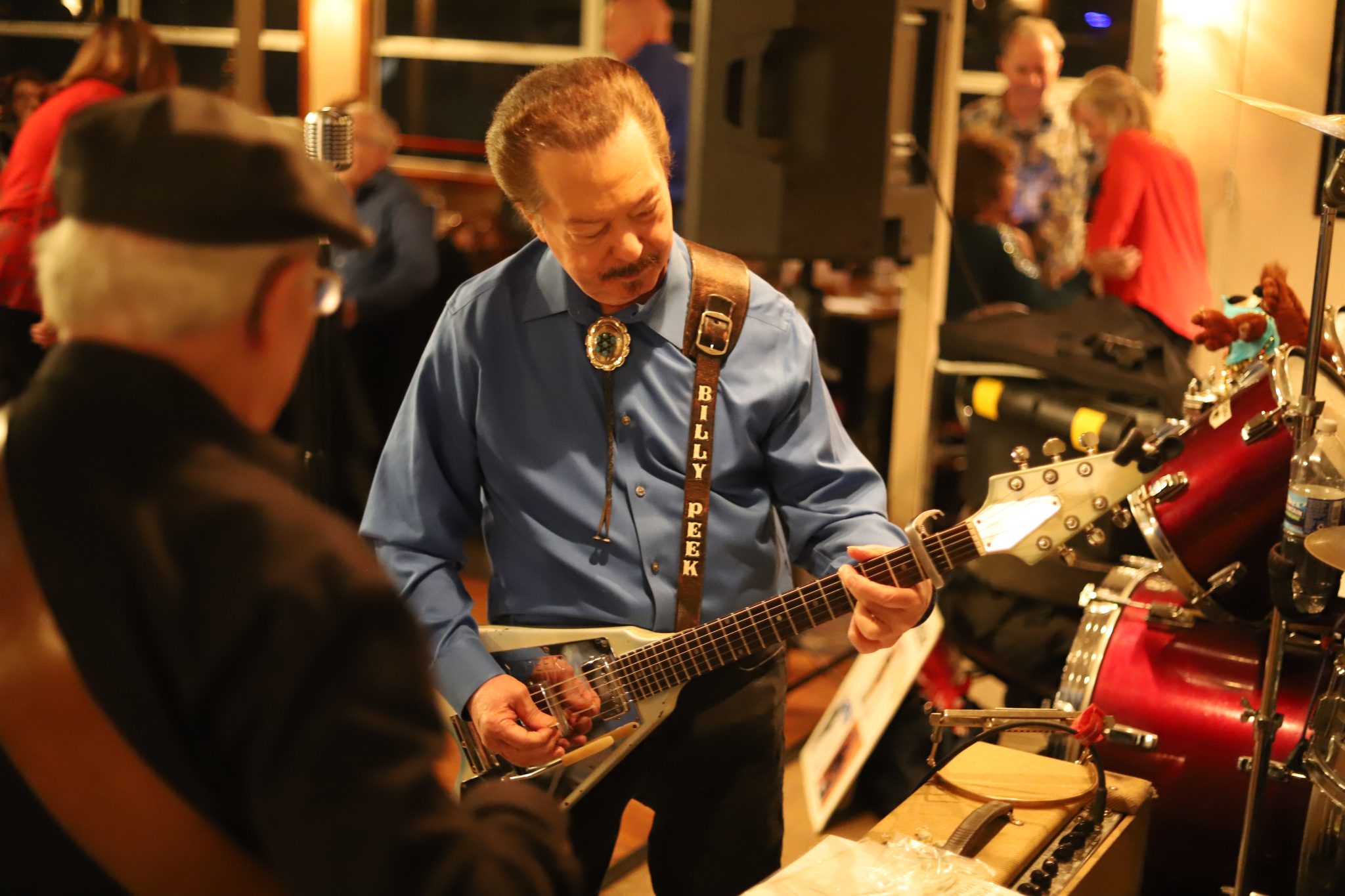 Artist Billy Peek strums his guitar while performing hit blues songs aboard a Blues Cruise on the Riverboats at the Gateway Arch.